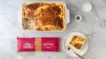 An image from above showing a baked pastitsio and the product packaging