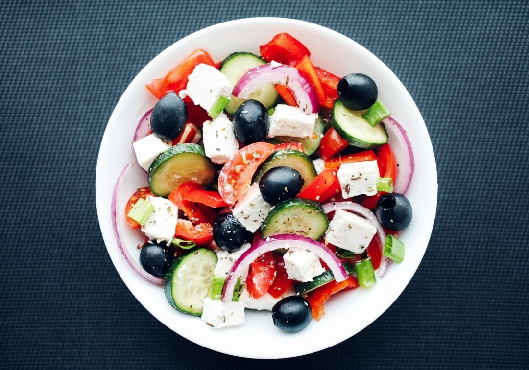 An image of a greek salad plate, view from above