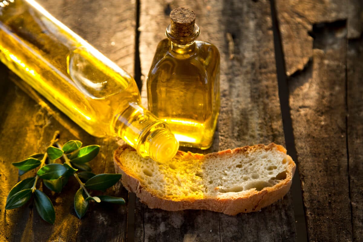 bottles of olive oil and sliced rustic bread