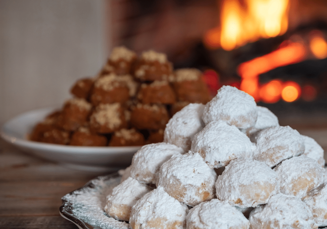 melomakarona and kourabiedes in a cosy atmoshere with a fireplace